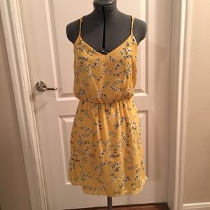 Yellow summer dress with white and blue flowers